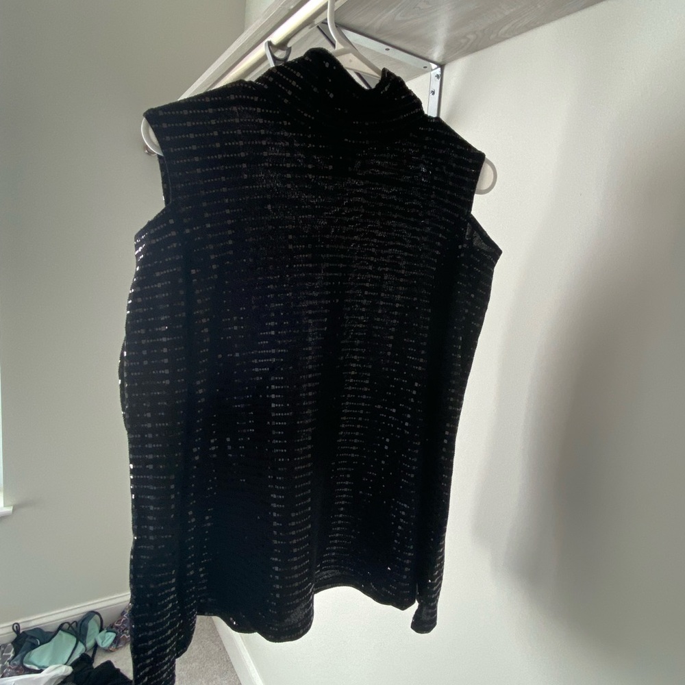 Black with holes at shoulders